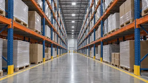 Long aisle of selective pallet racking in a warehouse where every pallet face is visible from the aisle