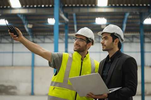 Engineer and manager reviewing a workflow redesign